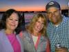 Regina, Susan & Clay with a beautiful sunset backdrop at M.R. Ducks.